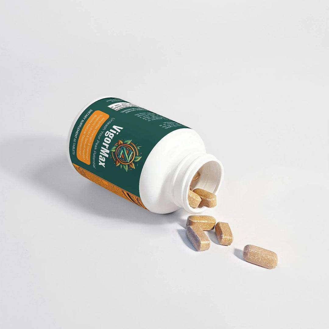 VigorMax bottle with tablets spilled, showing the natural blend and easy-to-swallow tablet size by Zukra Energy.